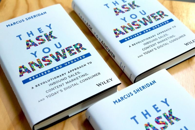 They Ask You Answer books on a table.