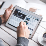 Person looking at Paid media KPIs on a ipad