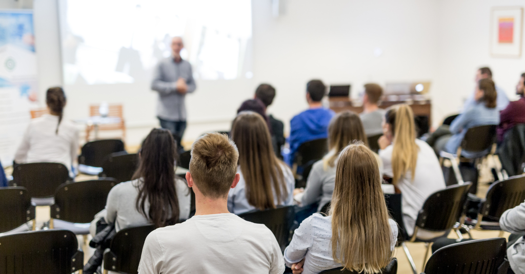 students listening on a professor.