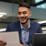 A person looking at a paper of Main HubSpot Features