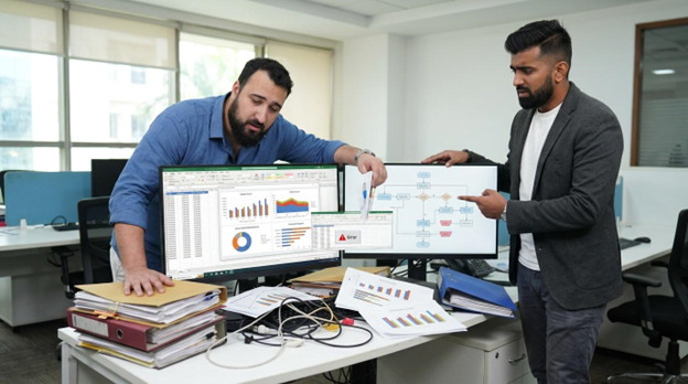 Team troubleshooting spreadsheet errors and a broken process flowchart, common issues addressed by CRM optimisation services.